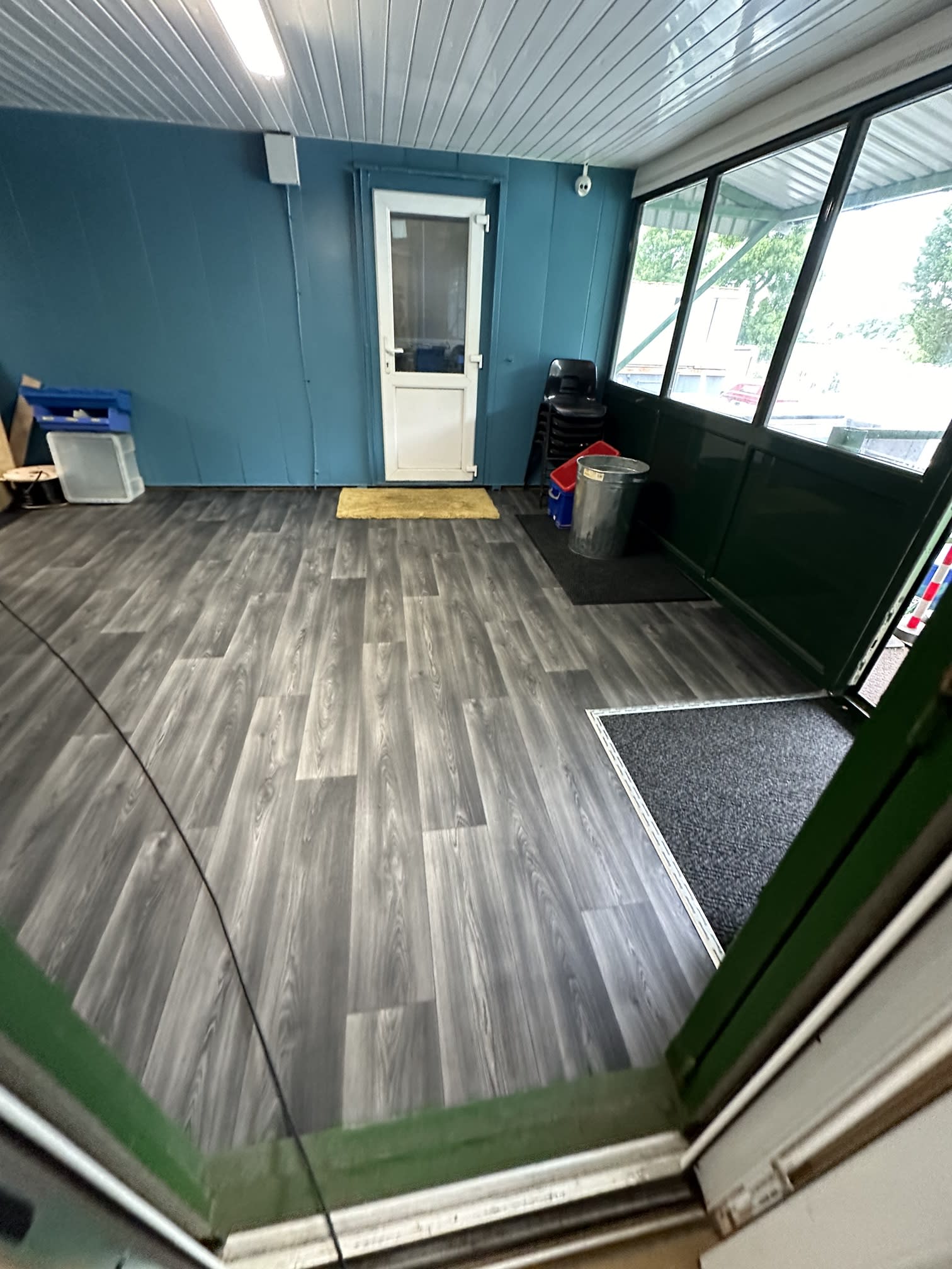 Cleaned communal entrance floor with glass doors after a commercial clean